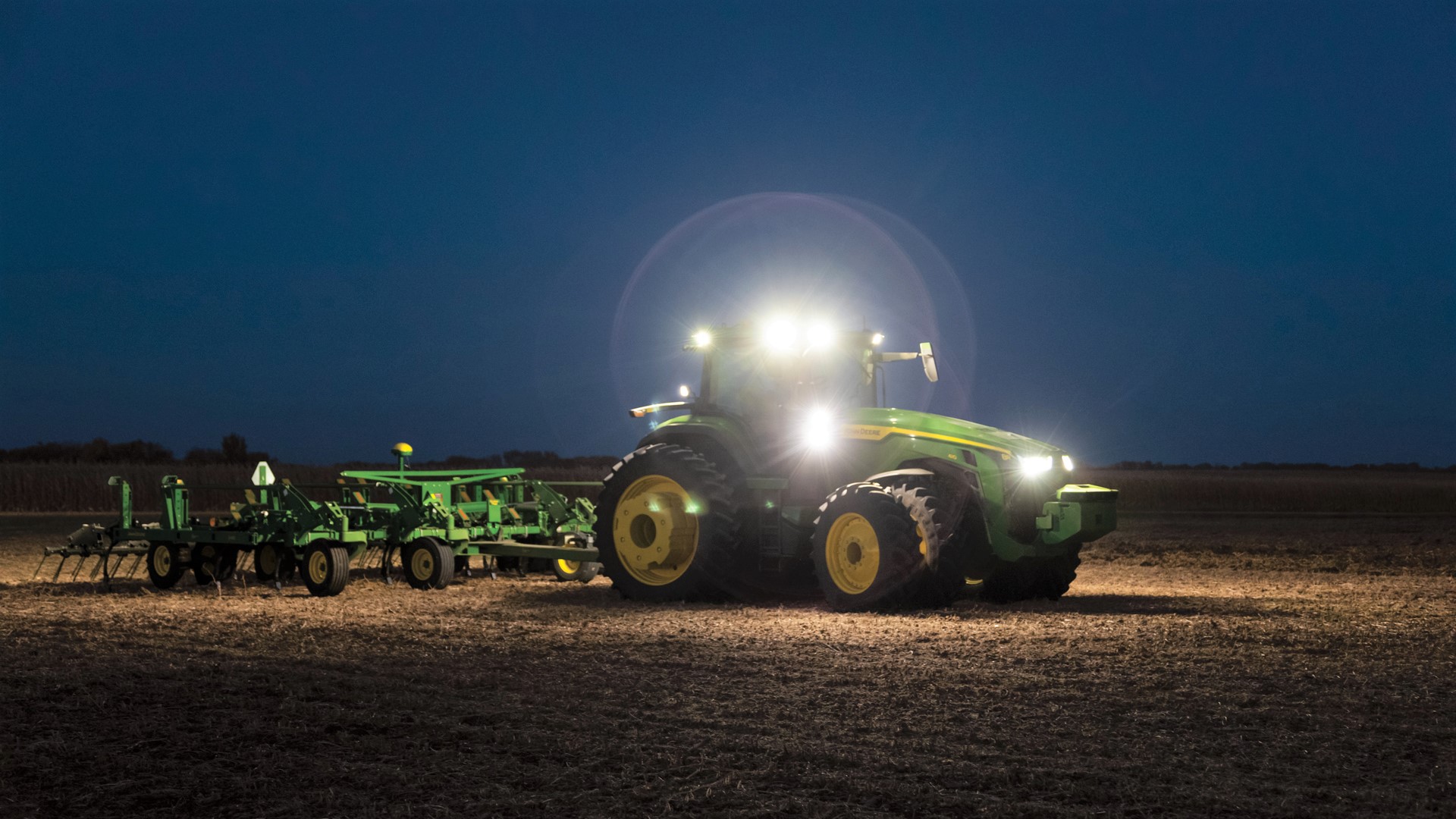 John Deere 8R autonomous tractor at night. (Source - Deere)