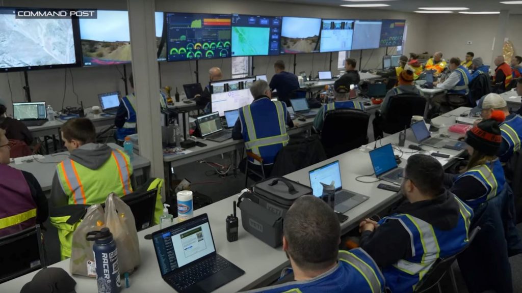 DARPA RACER observers look on from the Experiment 3 command post.